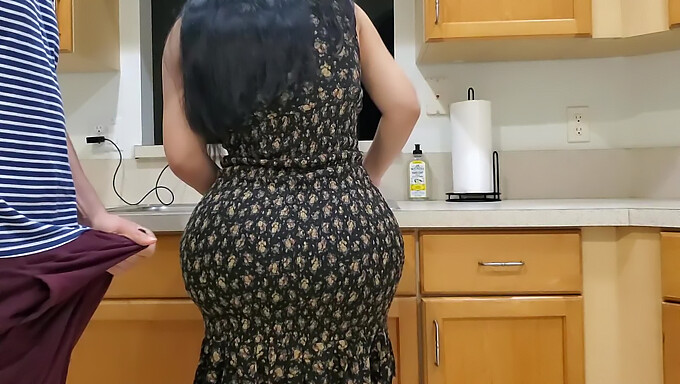 Brunette stepmom fucks her horny stepson in the kitchen